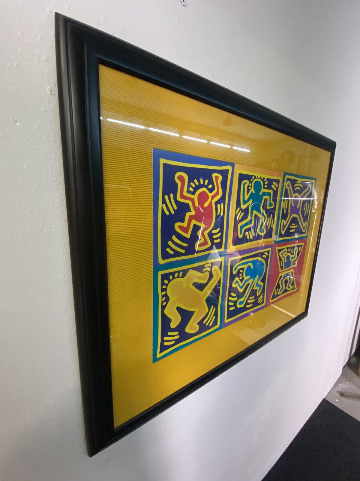 Bild Keith Haring Dancers Yellow 70x90 cm im schwarzen Rahmen/ Glas