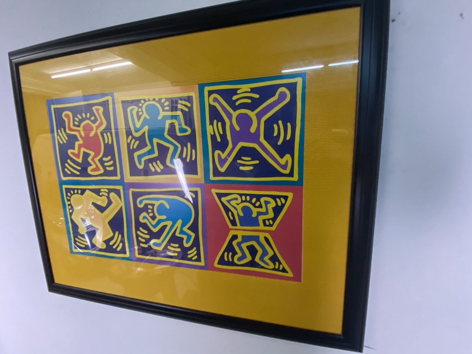Bild Keith Haring Dancers Yellow 70x90 cm im schwarzen Rahmen/ Glas