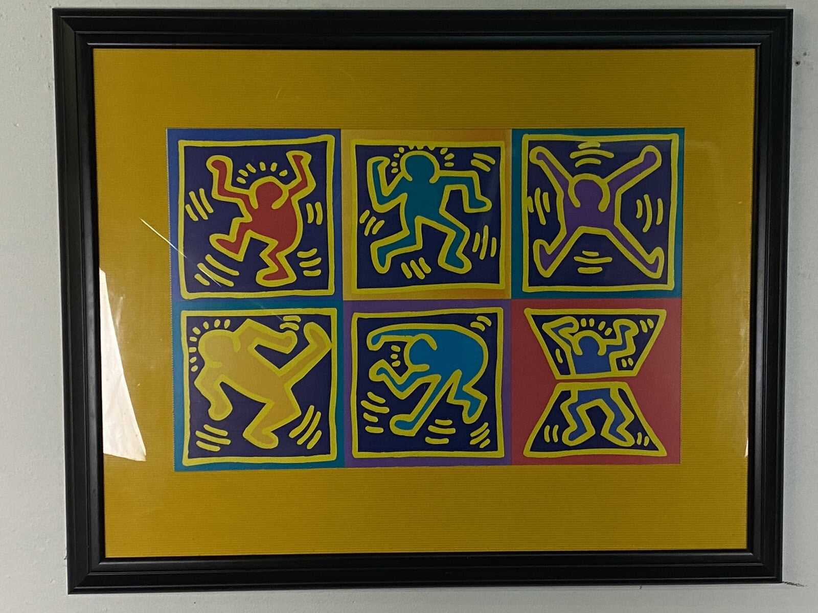 Bild Keith Haring Dancers Yellow 70x90 cm im schwarzen Rahmen/ Glas